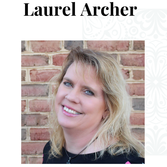 Laurel archer is smiling in front of a brick wall