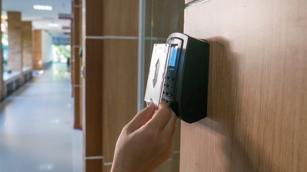 A Person is Using a Smart Card to Open a Door — DGC Tech Solutions In Mareeba, QLD