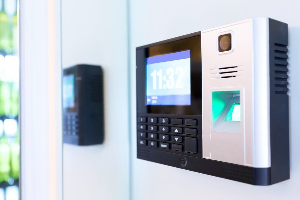 A Close Up of a Fingerprint Scanner on a Wall — DGC Tech Solutions In Mareeba, QLD