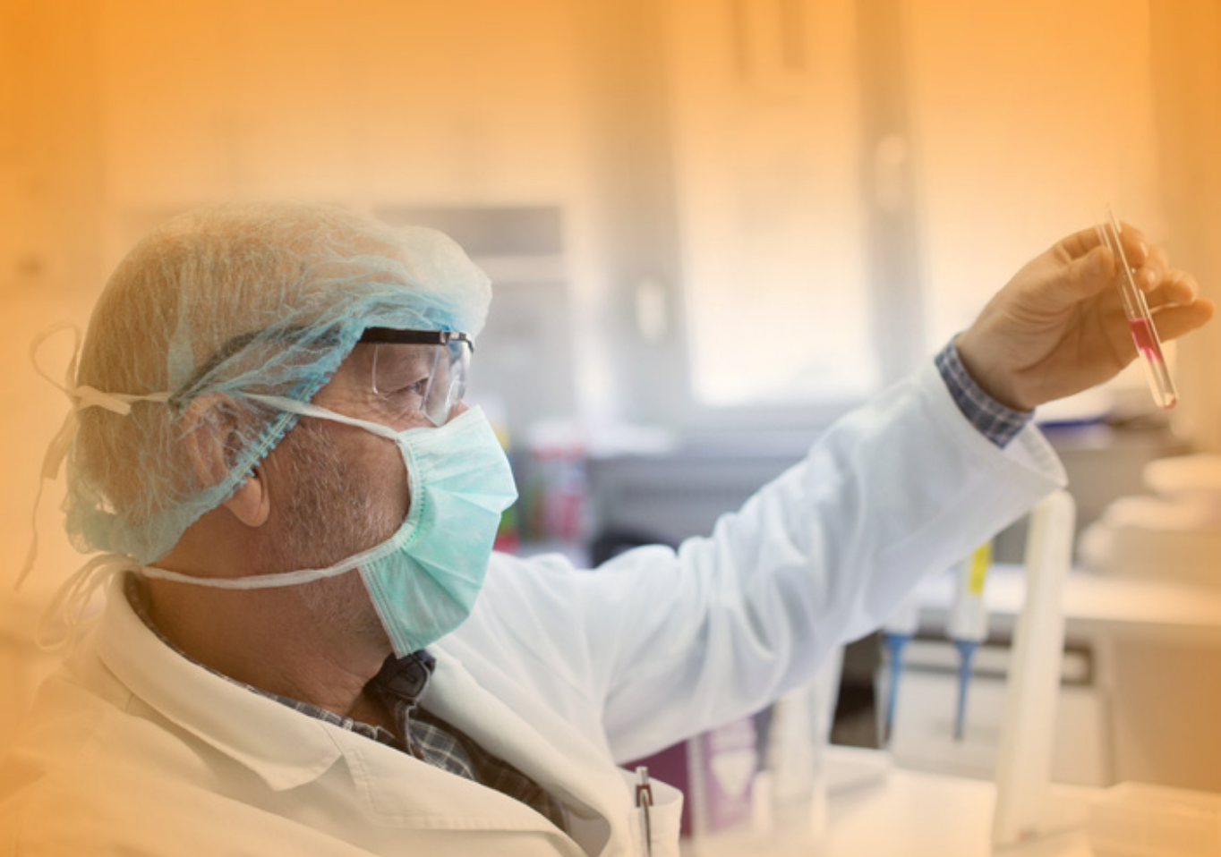 A male scientist is working in a lab.