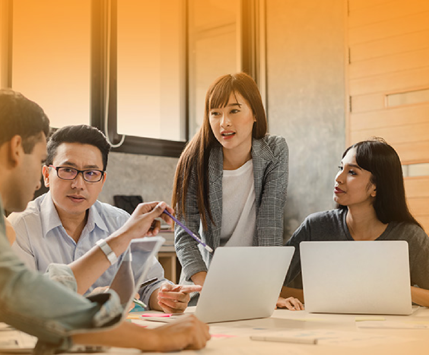 A group of four people is at a meeting