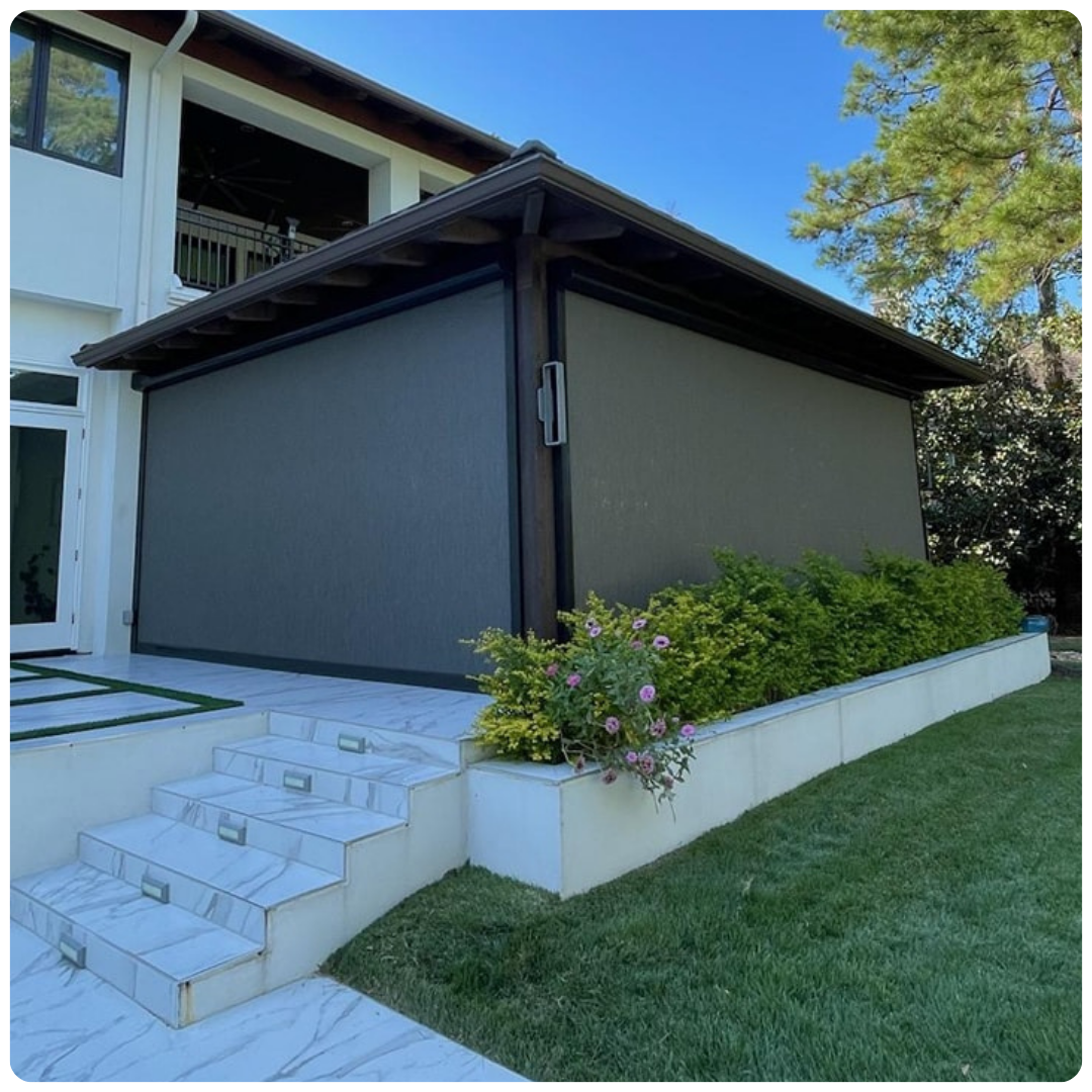 A house with a screened in porch and stairs in front of it.