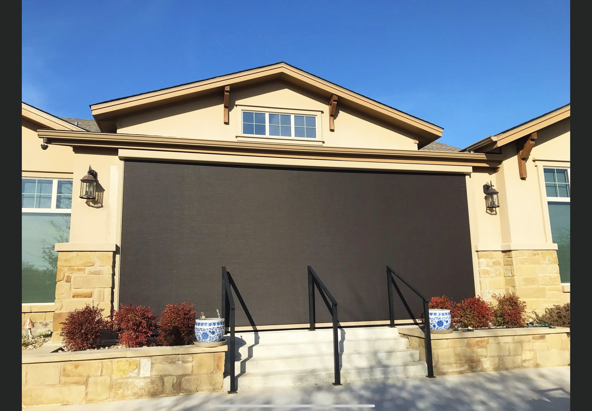 A house with a large screen on the front of it