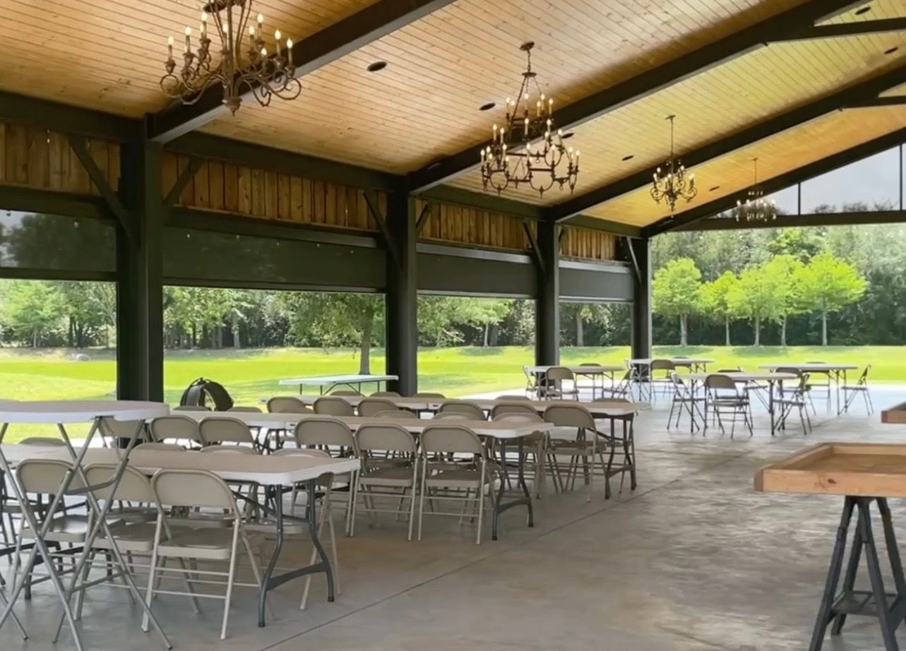 A large room with tables and chairs in it