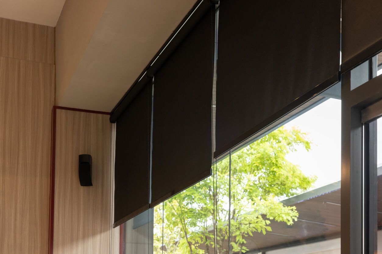 A hot tub on a deck with an awning over it
