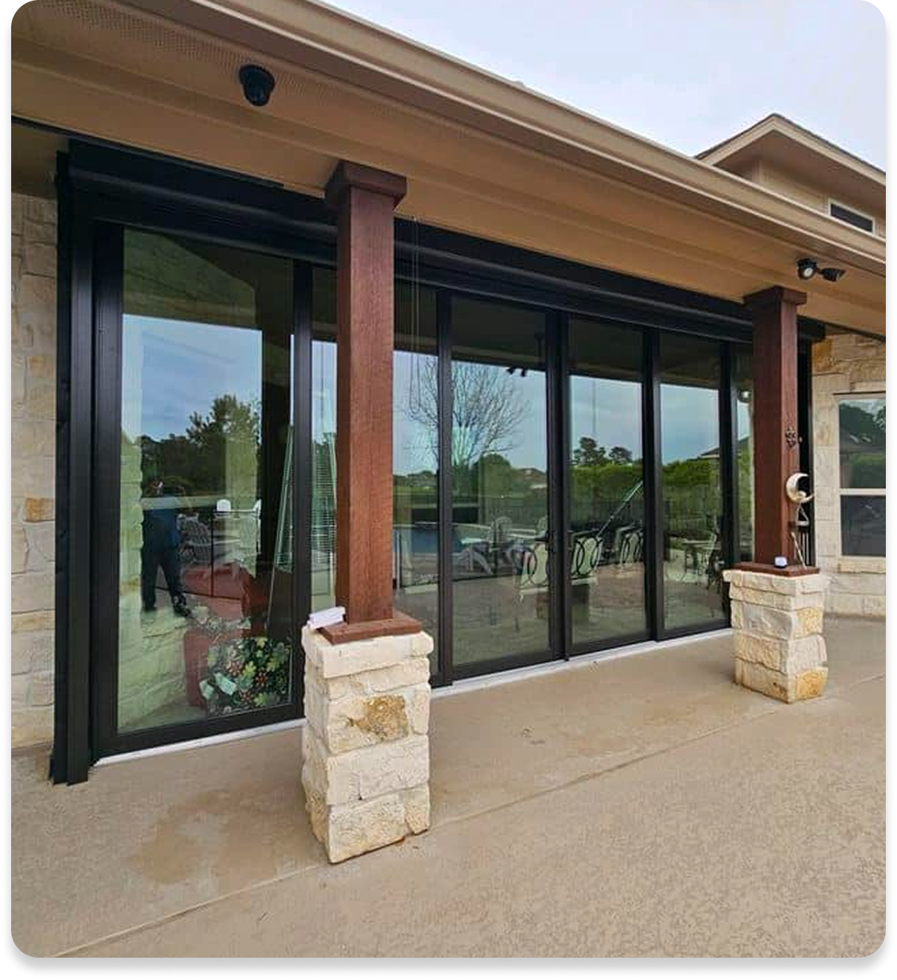 A house with a lot of windows and pillars