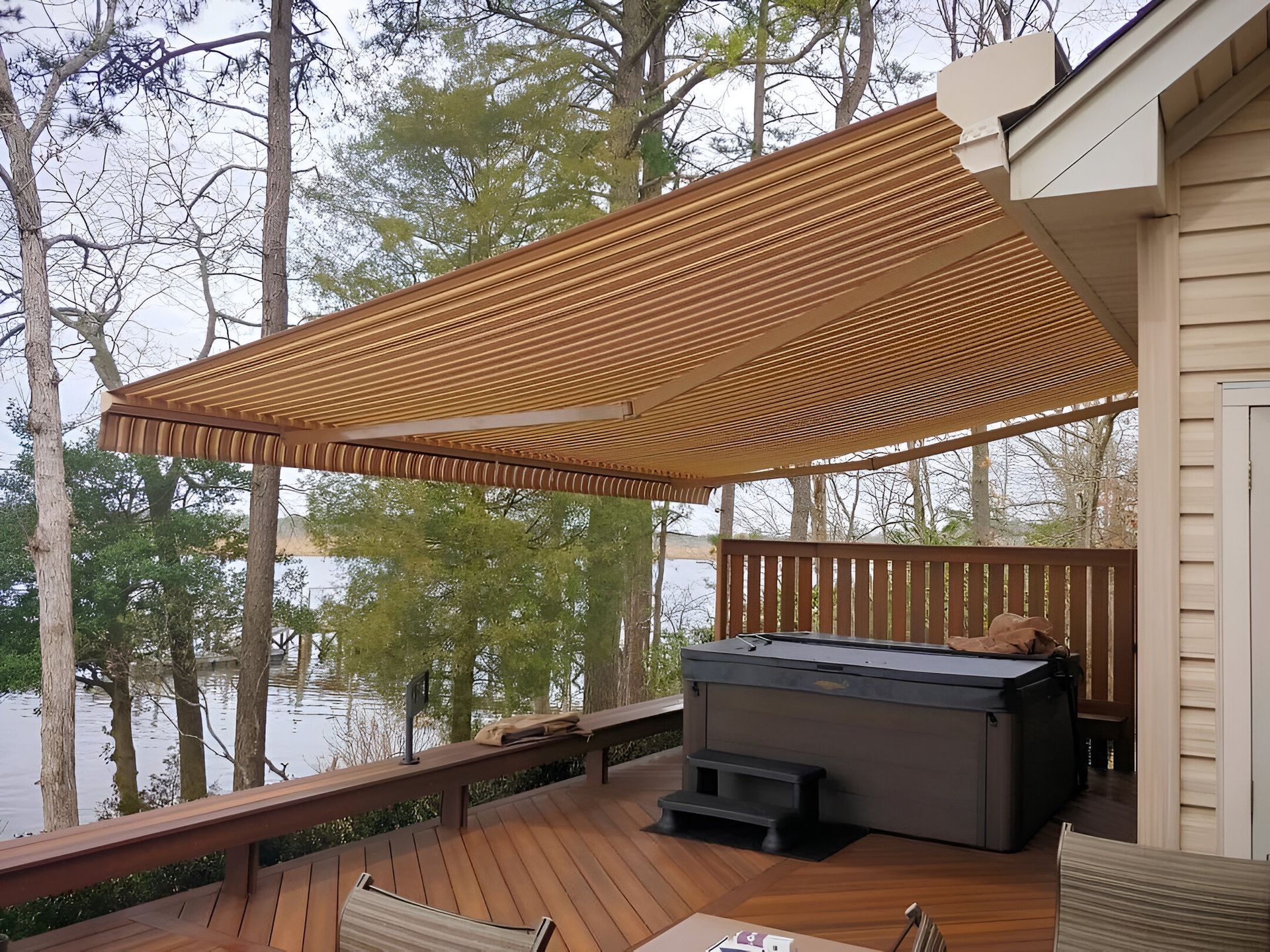 A deck with a hot tub and a canopy over it