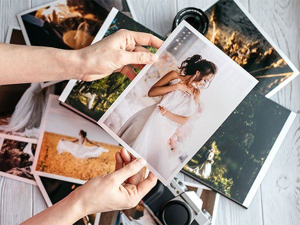 Hands holding prints