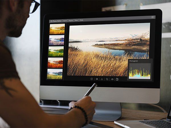 man working on a photo in a computer