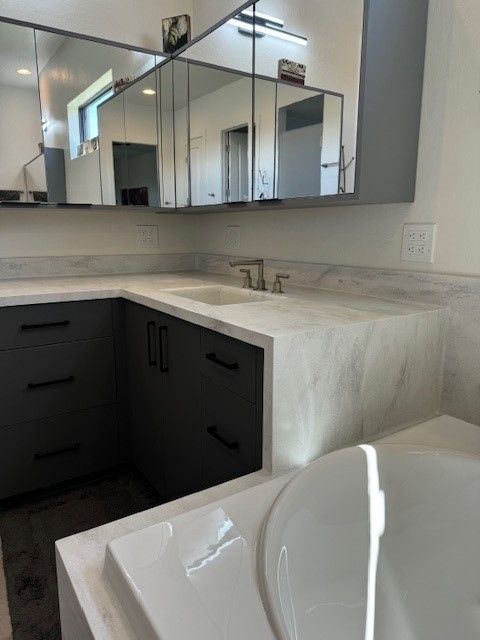 A bathroom with a sink and a bathtub