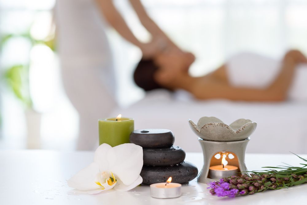 Young Man and Woman Lying Down on Massage Beds — Massage Therapy in Kirwan, QLD