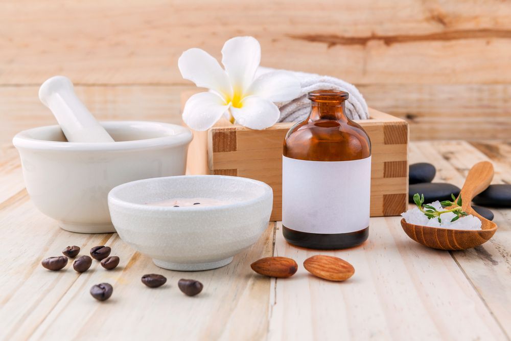 Massage Therapist Applying Oil in Hands — Massage Therapy in Kirwan, QLD