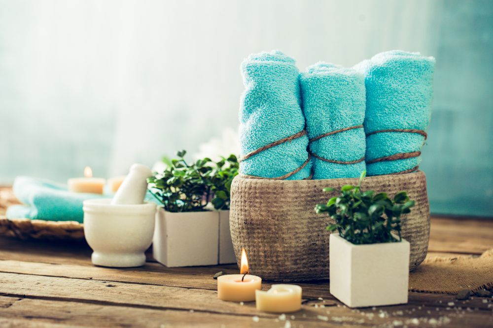 Picture of Woman in Spa Salon with Hot Stones — Massage Therapy in Kirwan, QLD