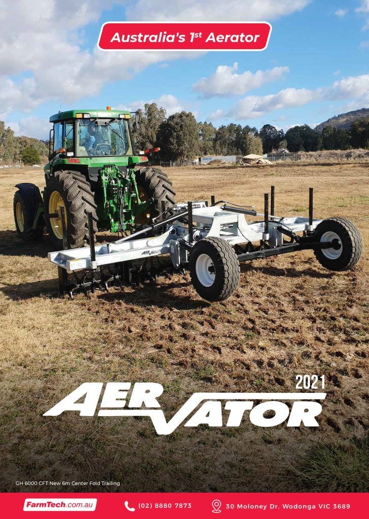 A tractor is plowing a field with a plow attached to it.