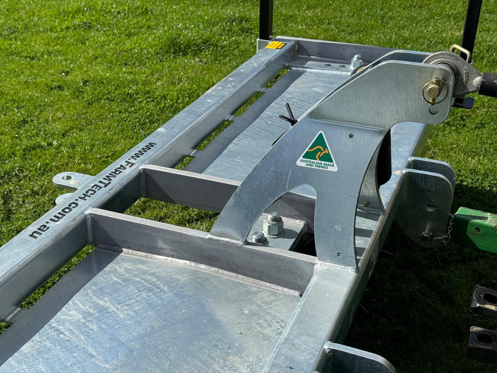 A tractor with a farmtech aerator attached to it