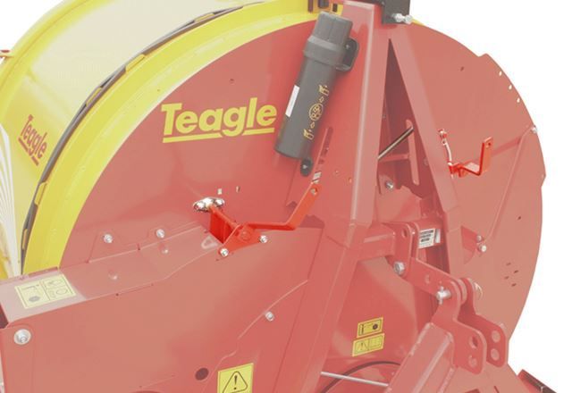 A red and yellow machine with the word teagle on it