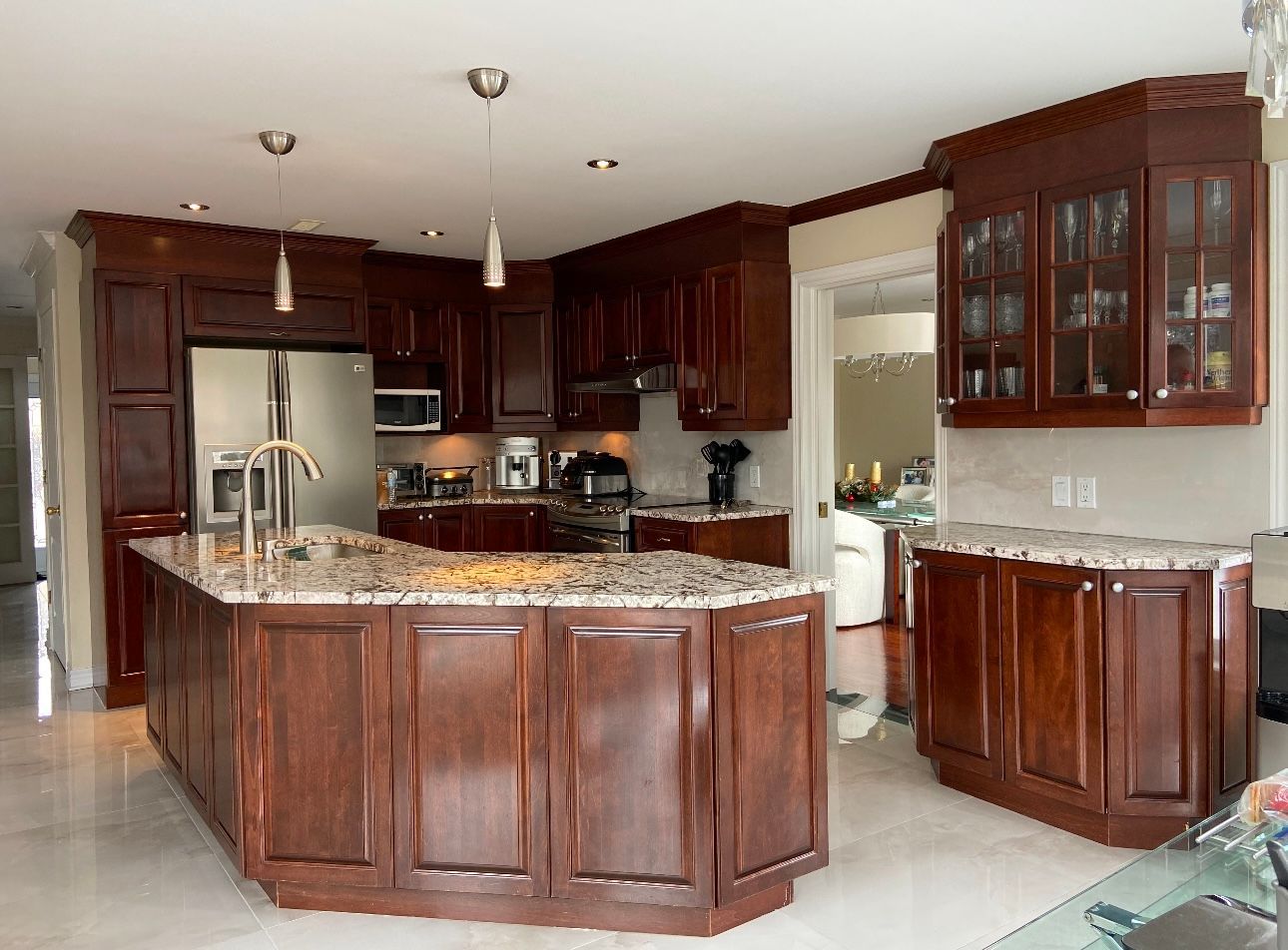 A kitchen with wooden cabinets and granite counter tops