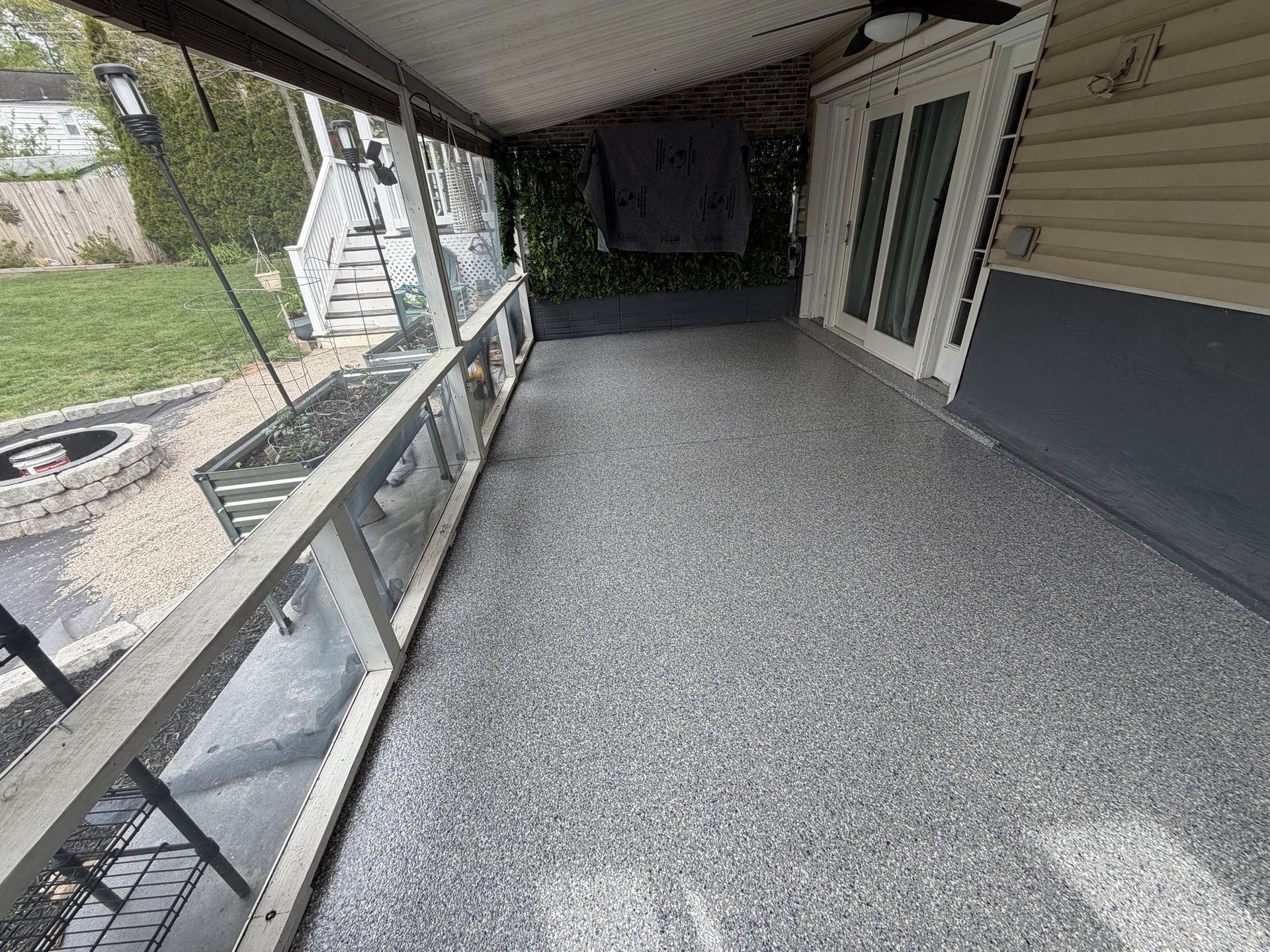 Covered back porch with a gray flake coating