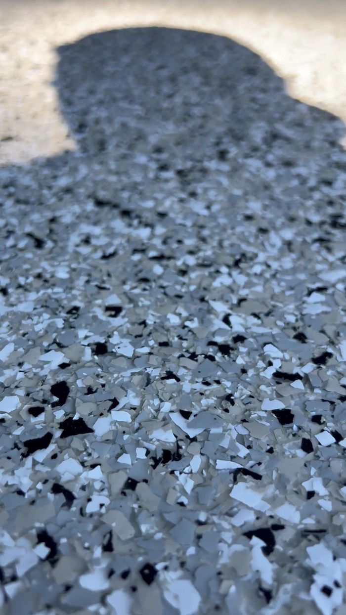Close-up of a decorative flake garage floor