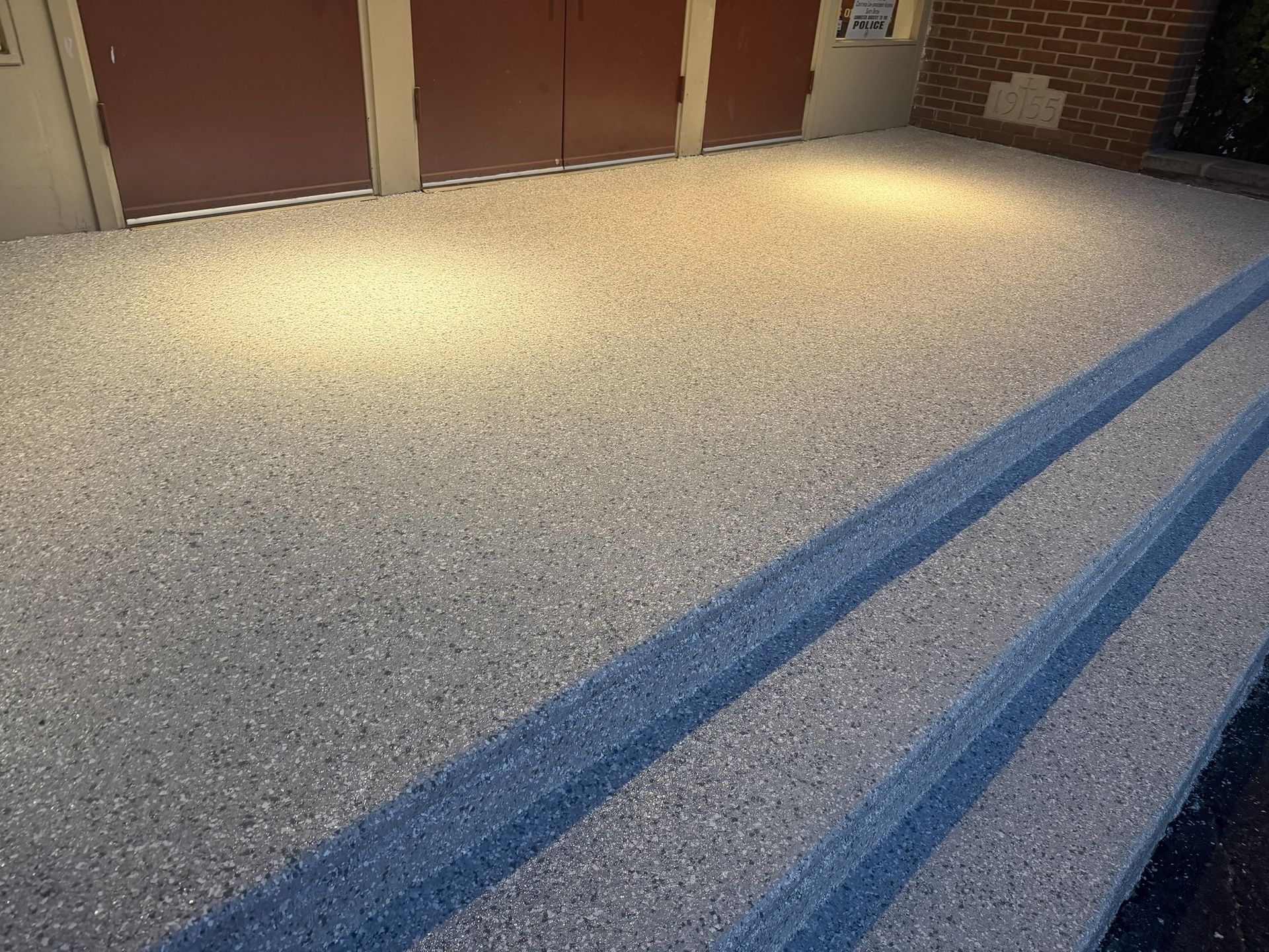 Close-up of a flake coating finish on concrete steps