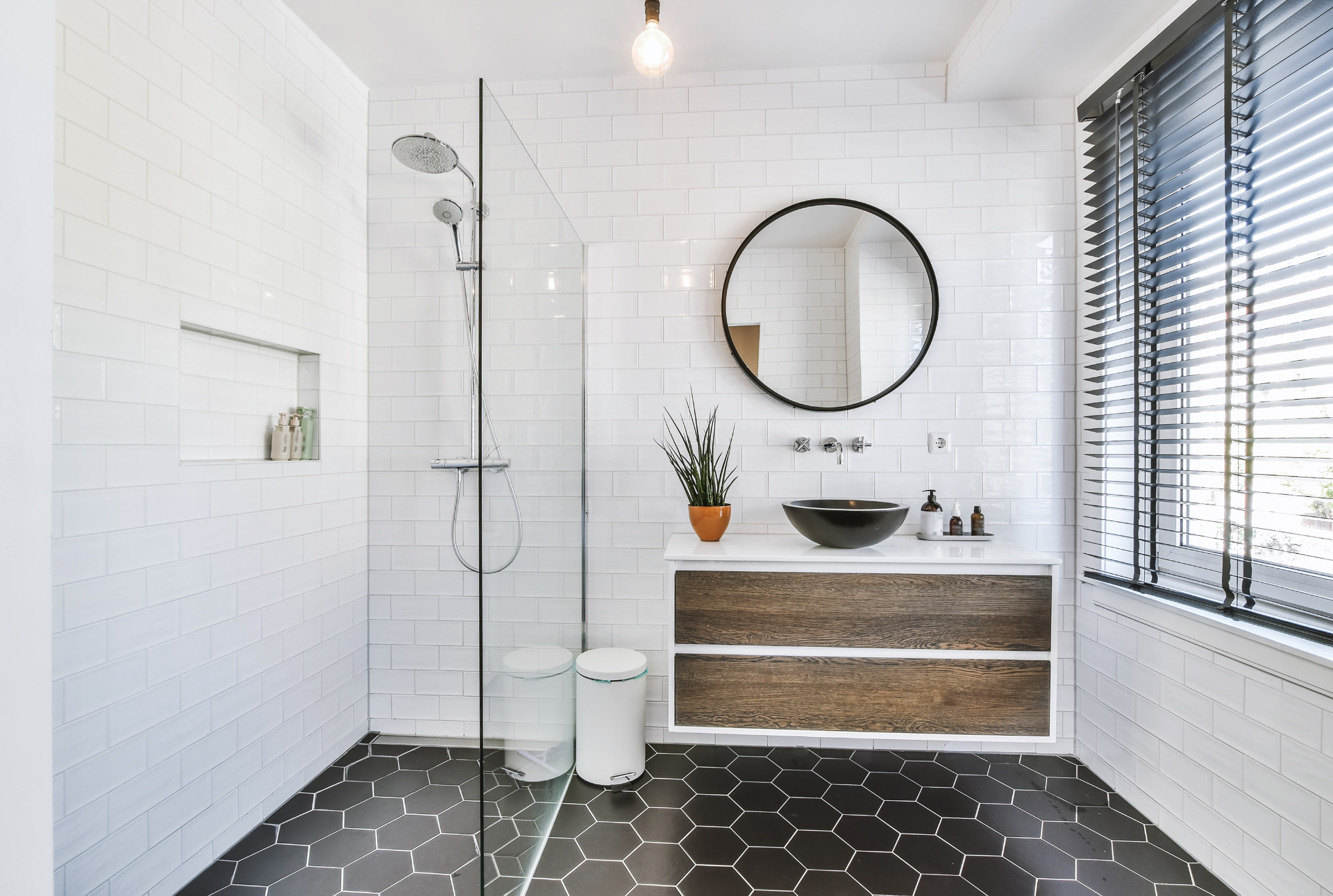 half bathroom with bold flooring