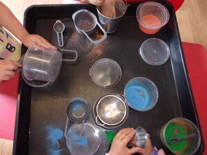 Three pupils mixing colours
