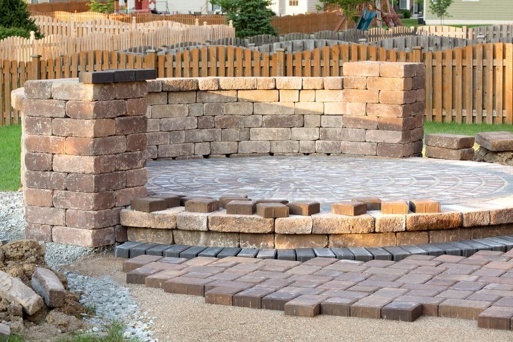 Stone steps and raised paving area part way through construction