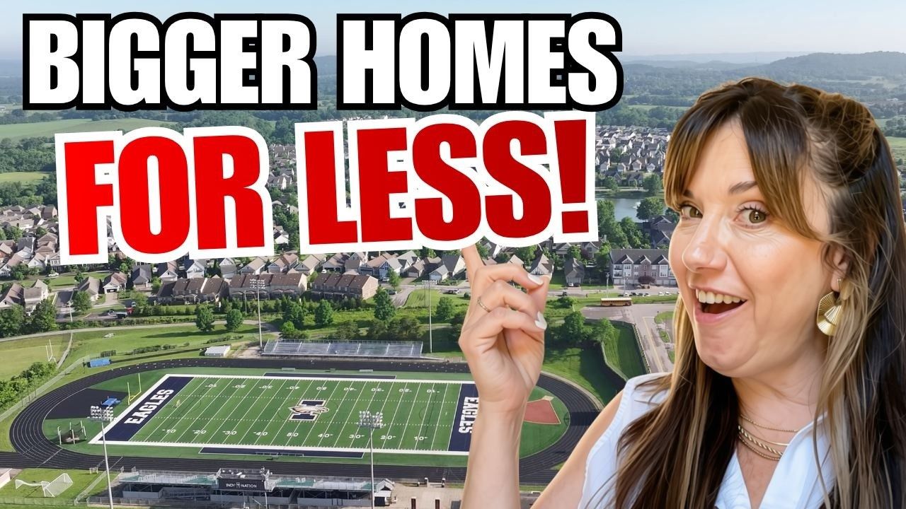 Bigger Homes for Less text over aerial view of a stadium and a smiling woman pointing at it