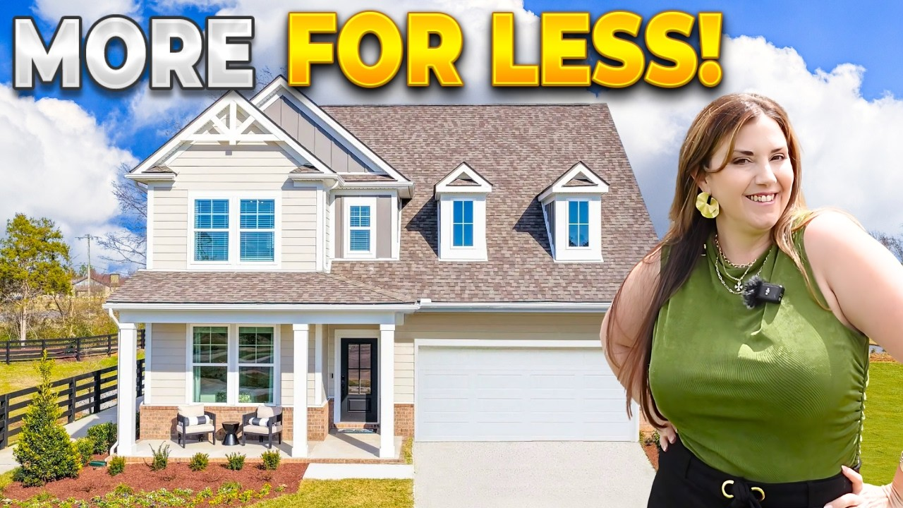House exterior with “MORE FOR LESS!” text and a woman standing beside it