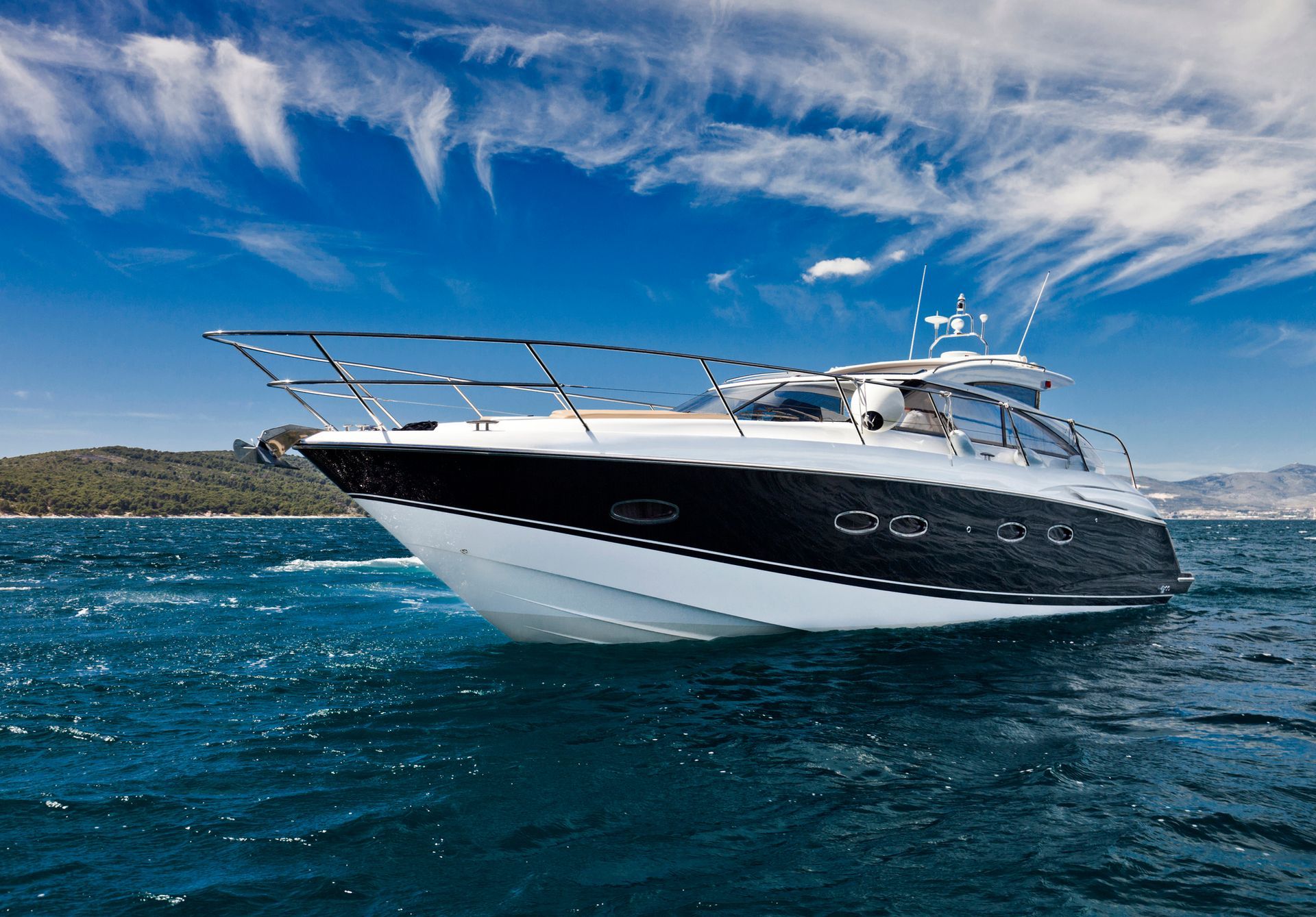 A boat is floating on top of a body of water.