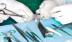 A group of surgical instruments are sitting on a table.