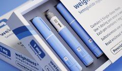 A box of weightloss pills with a pen in it.