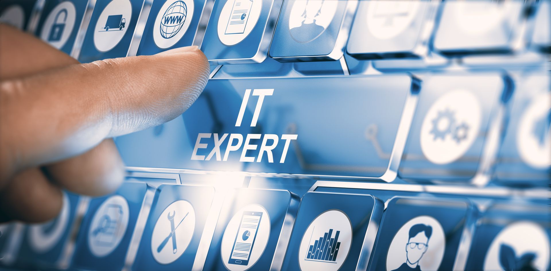 Finger pressing “IT EXPERT” key on a digital keyboard interface with tech icons.