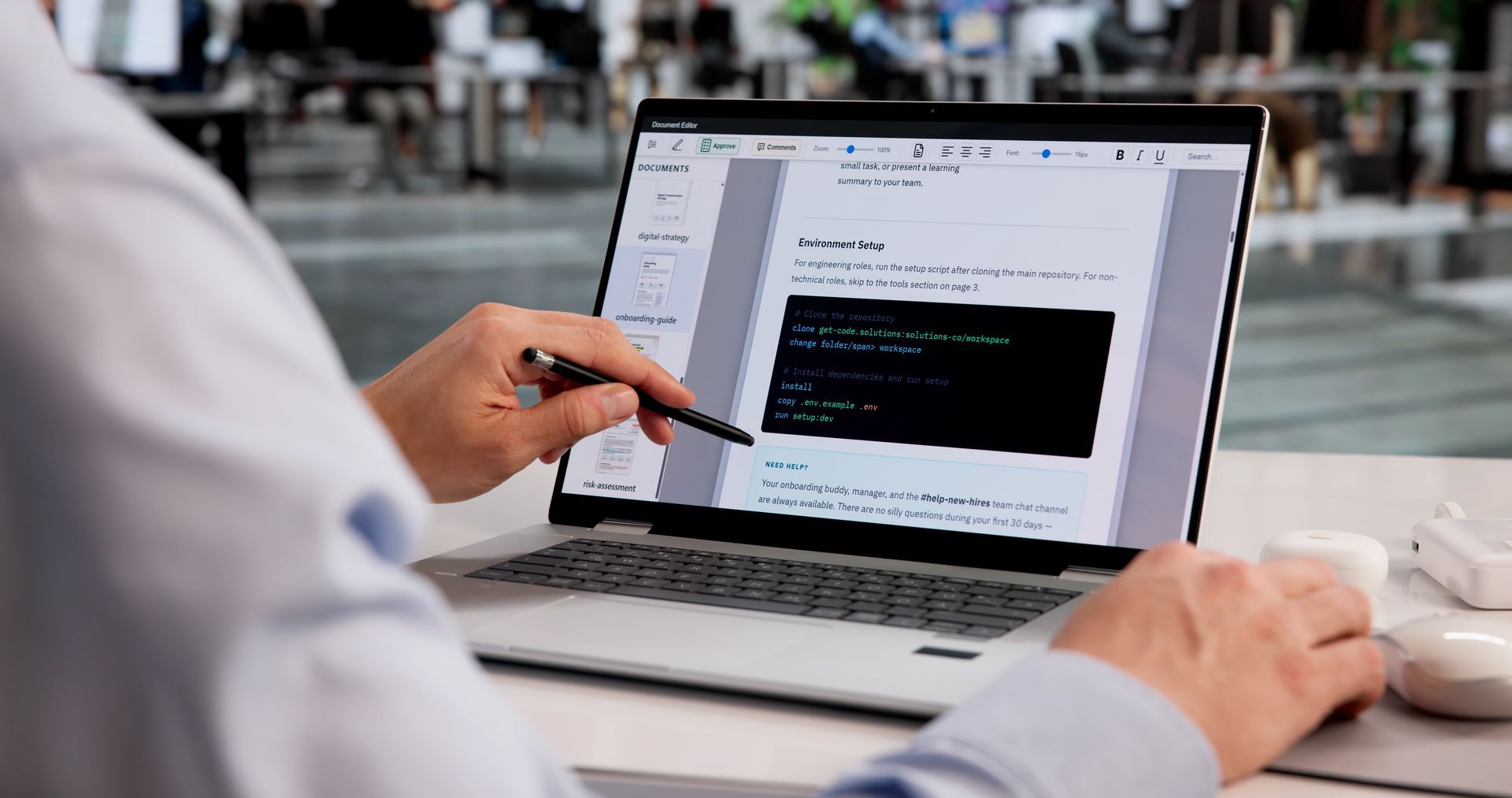 Man engaged in digital onboarding training on laptop.