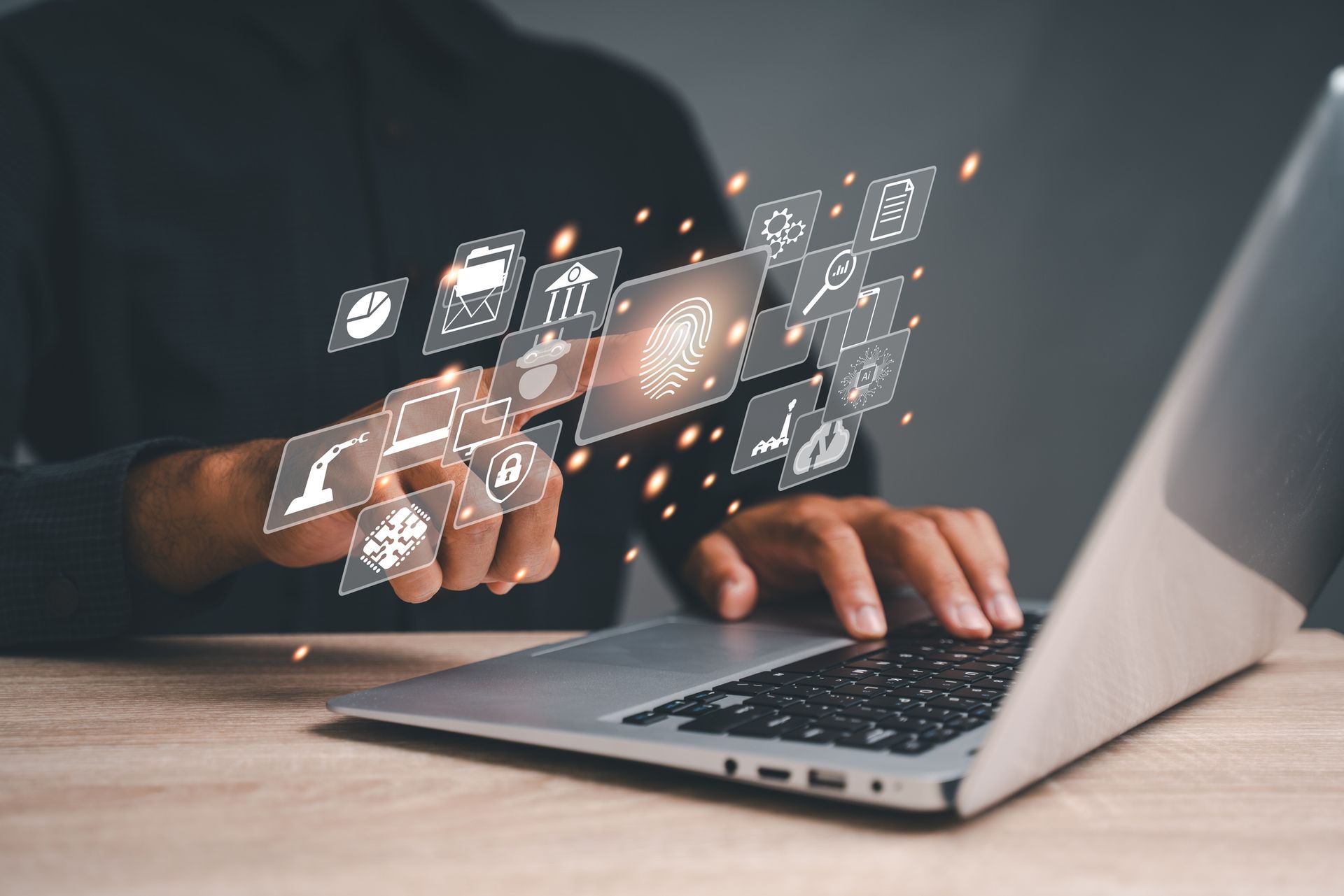 Conceptual picture of a businessman using a laptop with cloud computing technologies and more Conceptual picture of a businessman using a laptop with cloud computing technologies and more