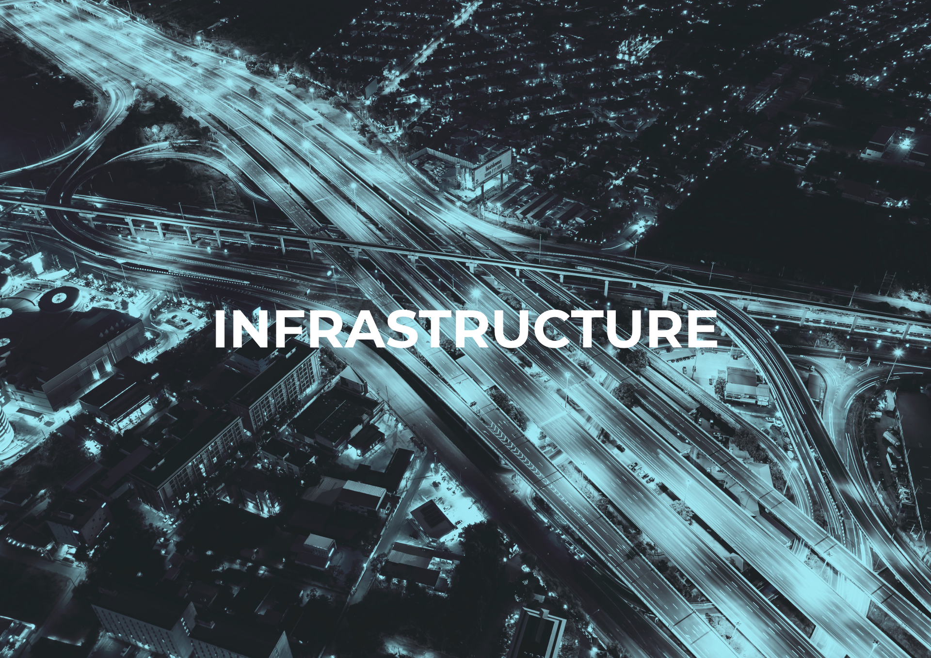 Aerial view of a city highway interchange at night with the word 