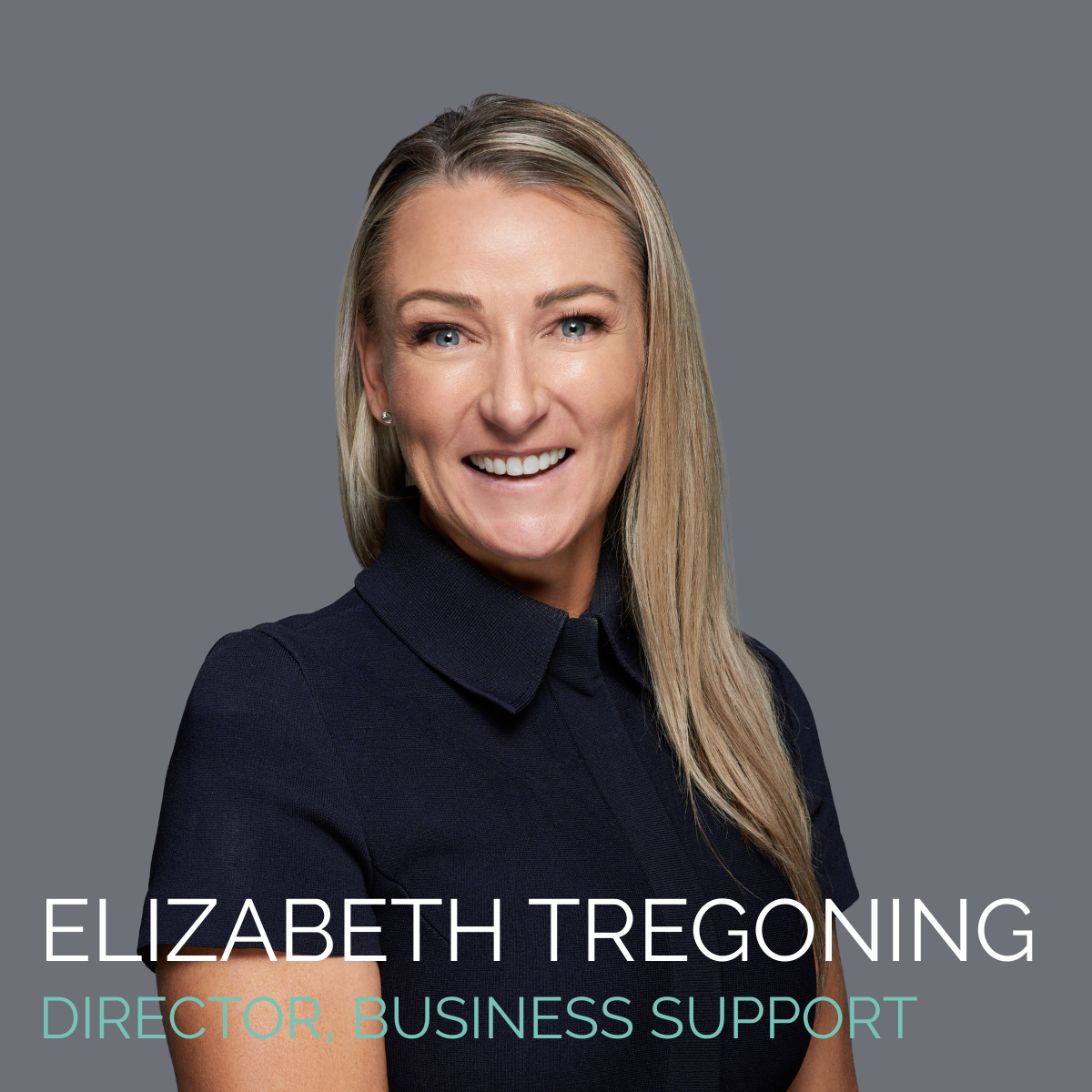 Elizabeth Tregoning, Director of Business Support, smiles at the camera, wearing a dark blue shirt against a gray background.
