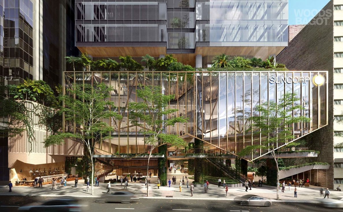A large building with a lot of windows and trees in front of it.