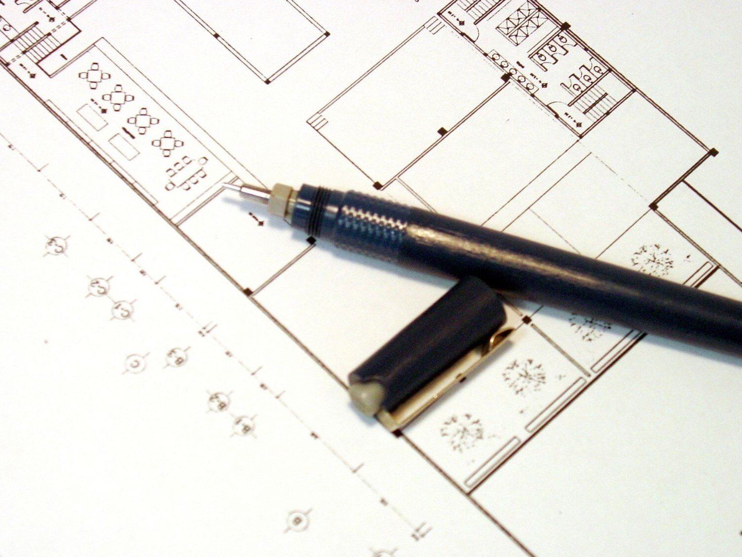 Architectural drawing on commercial building with black pen on top of drawing