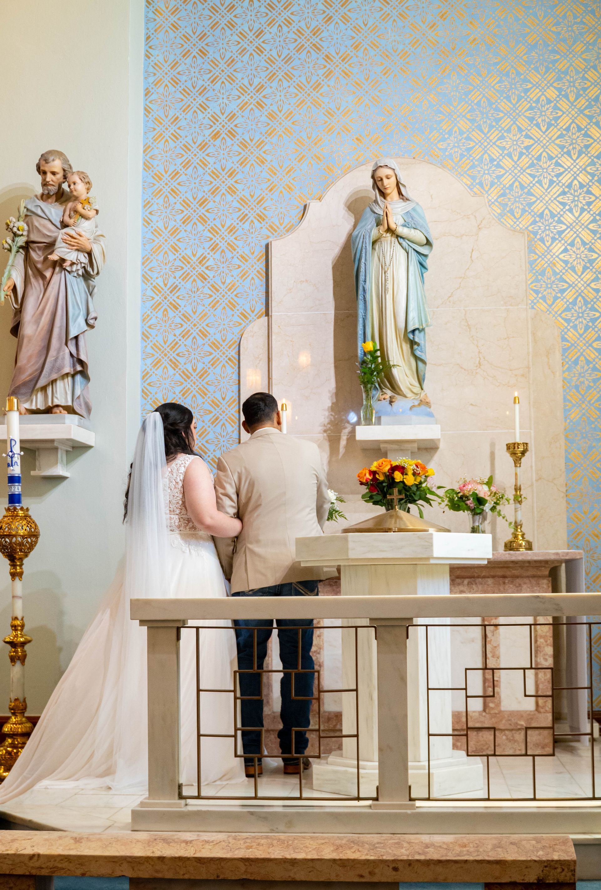 Bride and groom standing at a church altar during a wedding ceremony