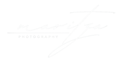 White minimalist logo with faint cursive signature and the word “PHOTOGRAPHY” underneath