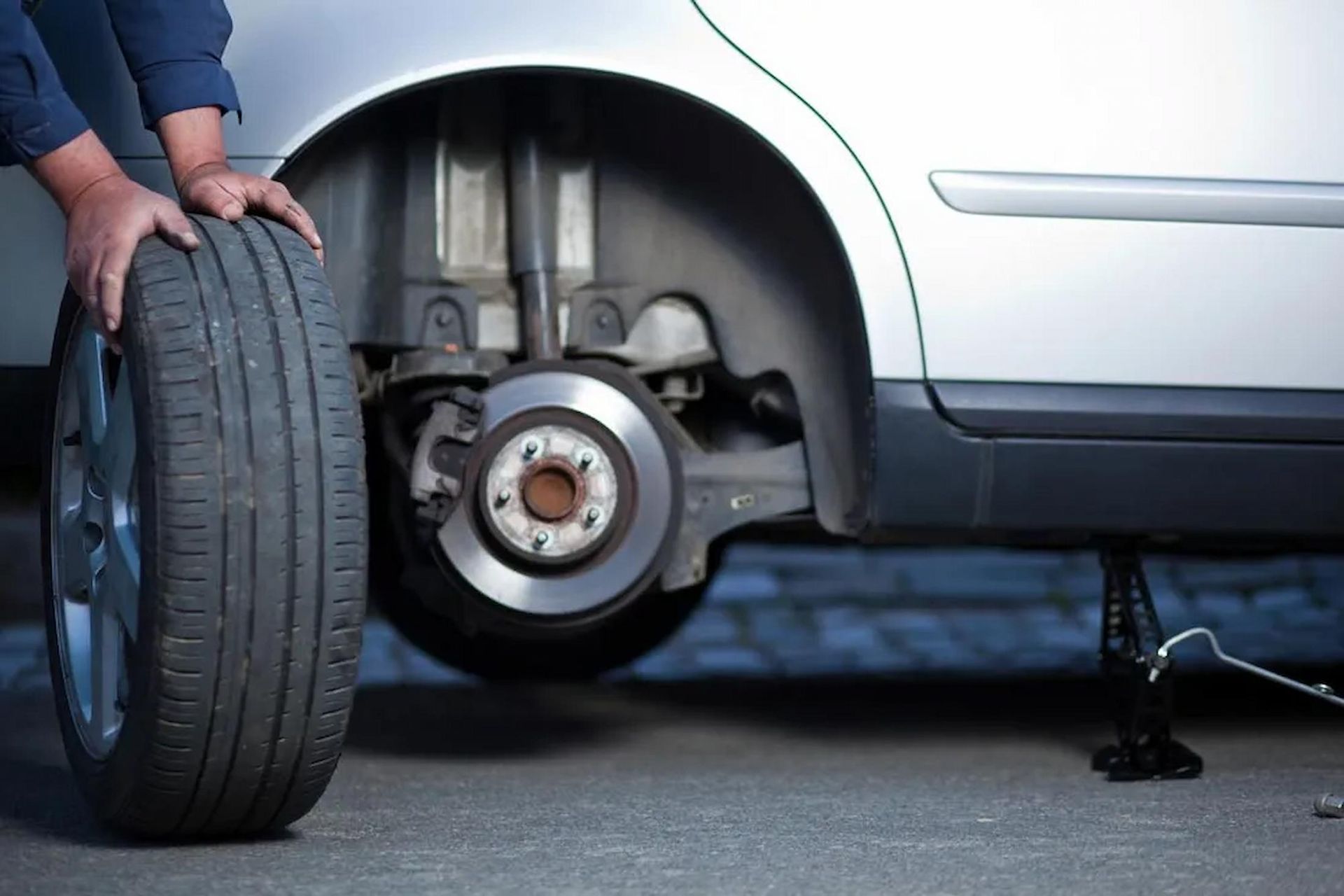 Man Replacing Of Tyres On The Central Coast