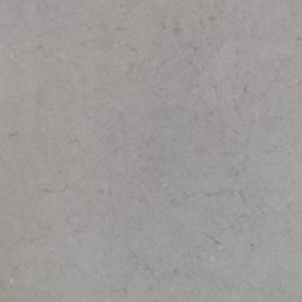 A close up of a gray tile with a grainy texture.