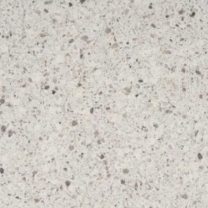 A close up of a white granite counter top.
