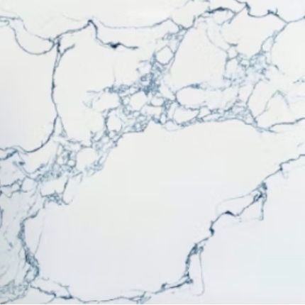 A close up of a luxurious white marble counter top with blue veining.