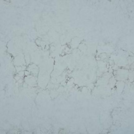 A close up of a gray green quartz counter top.