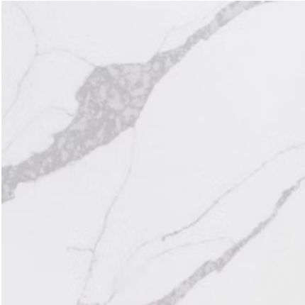 A close up of a white marble counter top with a gray vein.