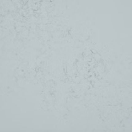 A close up of a grayish blue quartz counter top.