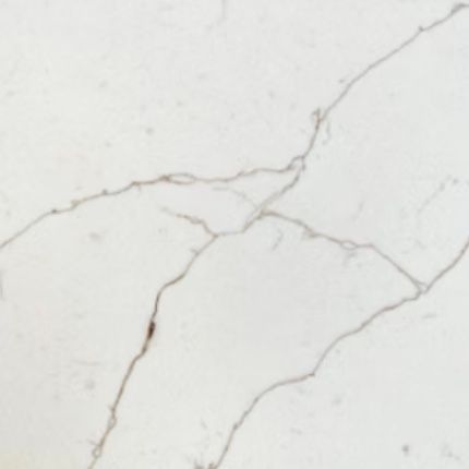 A close up of a white marble counter top with cracks.