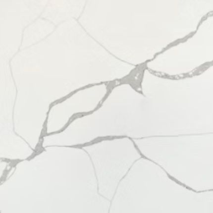 A close up of a white quartz counter top with a unique gray marble pattern.